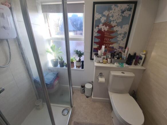 Bright, modern bathroom with a walk-in shower, ...