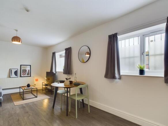 A spacious and stylish modern living room, perf...