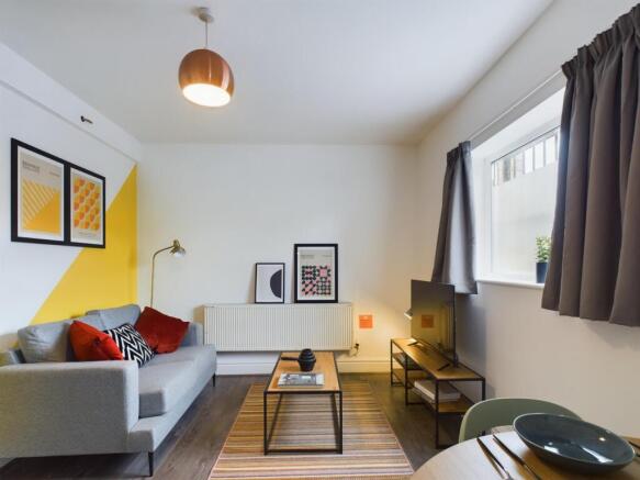 A spacious and stylish modern living room, perf...