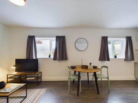 A spacious and inviting modern living room perf...