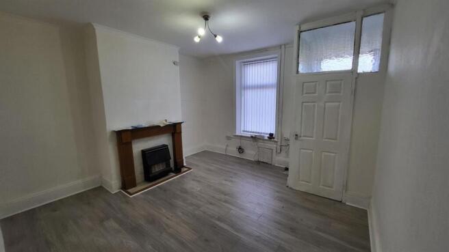 Bright, freshly decorated living room with neut...