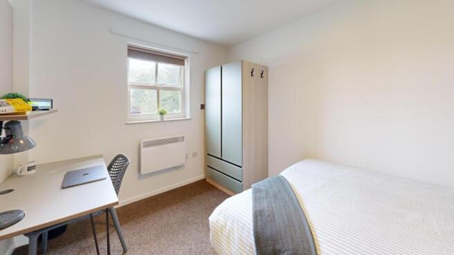 Bright, neatly presented bedroom with a double ...