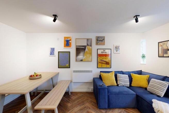 Bright, modern communal living space with a com...