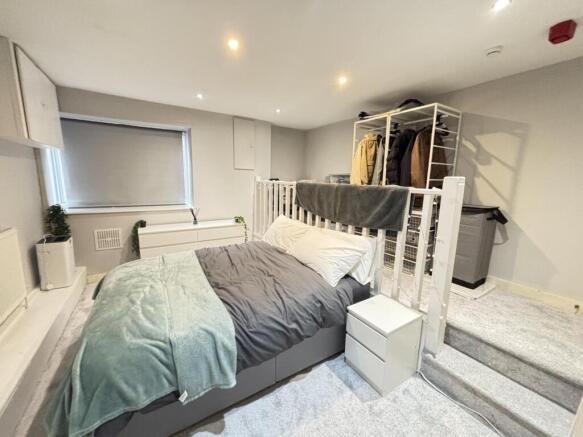 A spacious and well-maintained master bedroom f...