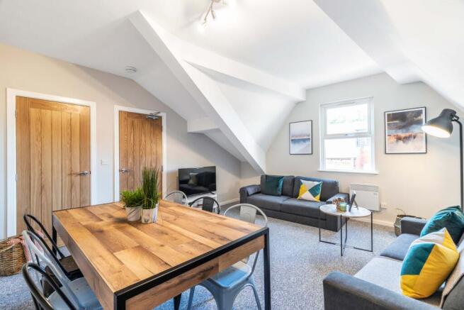 Bright, modern living room featuring comfortabl...