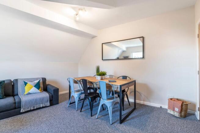 A bright and inviting living room featuring mod...