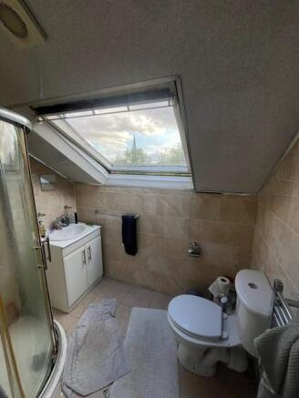 A well-maintained bathroom with a large window ...