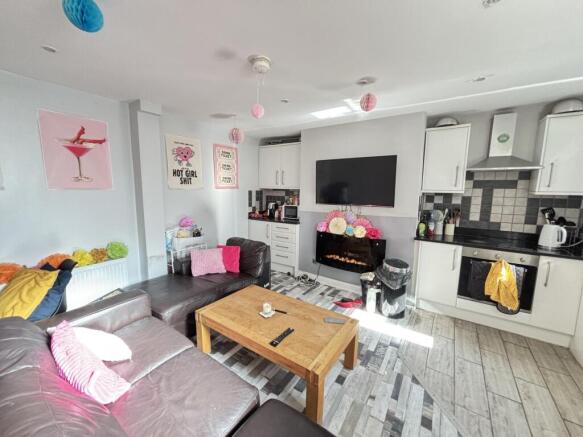 A bright and spacious living room with contempo...