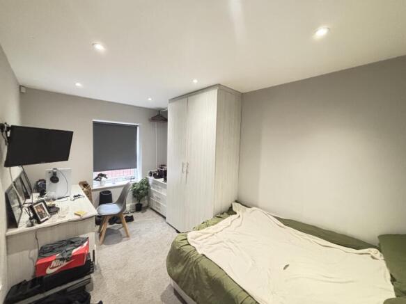 A spacious and well-maintained master bedroom f...