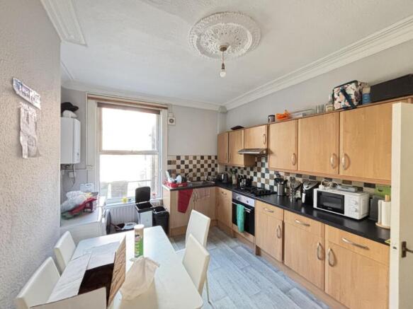 A well-organized kitchen with ample natural lig...
