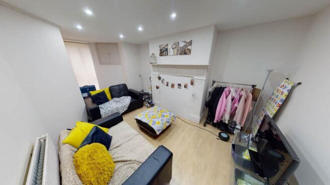 A bright and welcoming living room featuring a ...