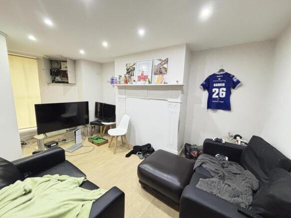 A bright and spacious living room featuring mod...