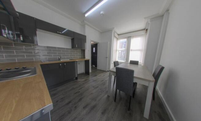 Bright and modern living room featuring large w...