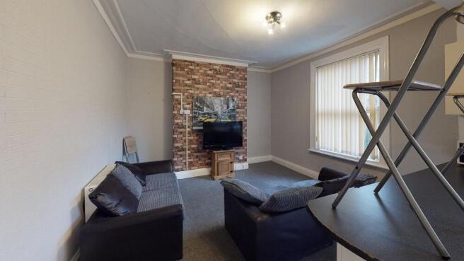 Bright and inviting living room featuring comfo...