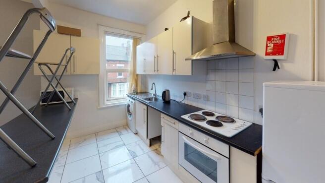A modern and well-maintained kitchen area featu...