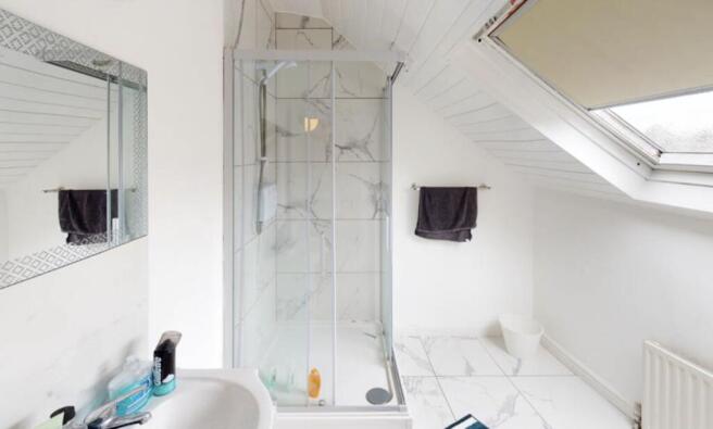 Bright and modern bathroom with a spacious show...