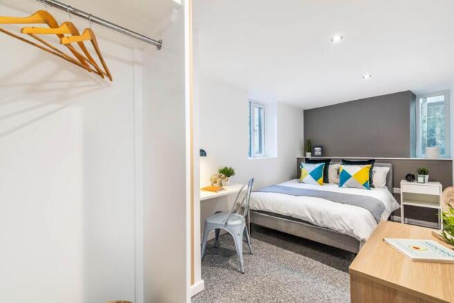 Bright and welcoming master bedroom with ample ...