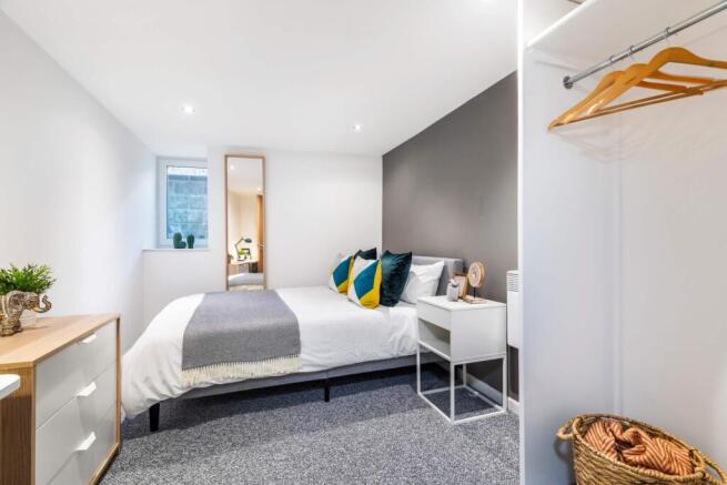 A bright and well-maintained spacious bedroom f...