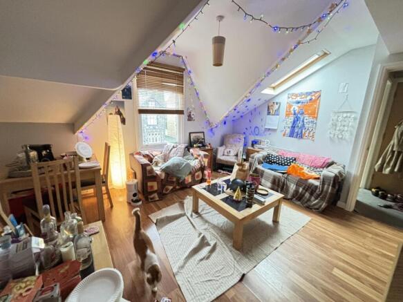 A bright and inviting living room with large wi...