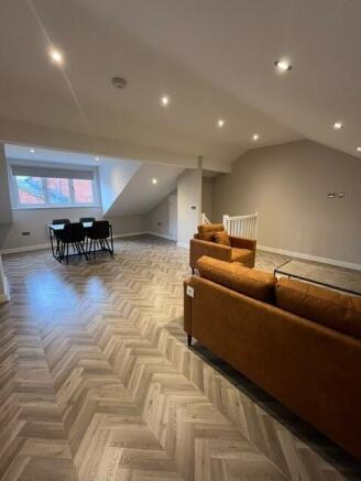 Bright and spacious living room featuring moder...