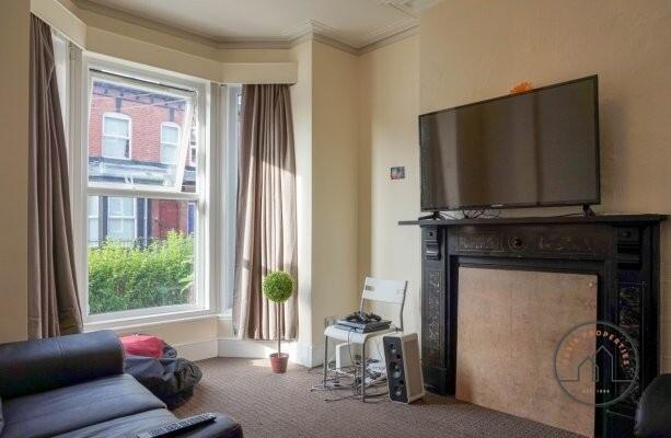 A bright and modern living room with a large wi...