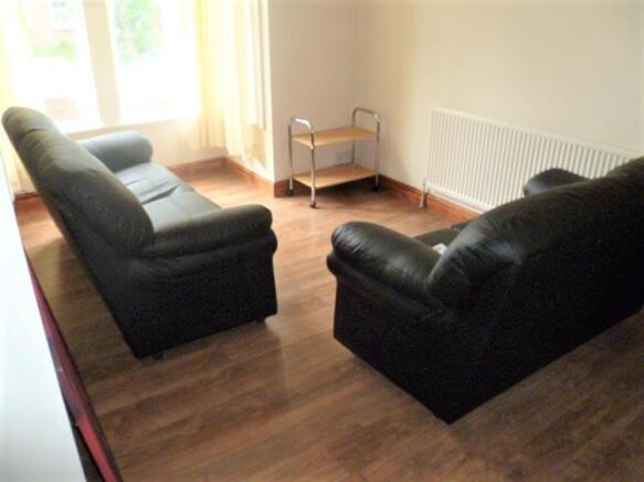 A cozy living room featuring two comfortable bl...