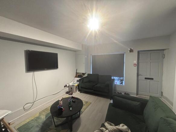 A modern, well-lit living room with comfortable...