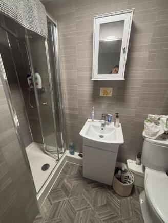 A clean, well-maintained bathroom featuring a m...