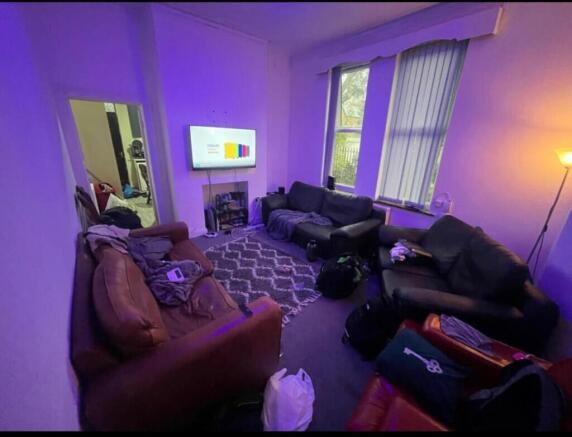 A cozy and inviting living room featuring comfo...