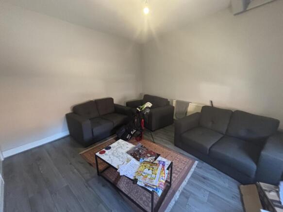 A spacious and well-maintained living room feat...