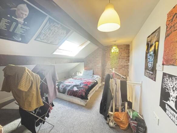 A bright and cozy bedroom with natural light fr...