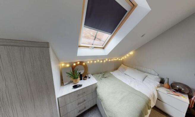 A bright and spacious master bedroom featuring ...