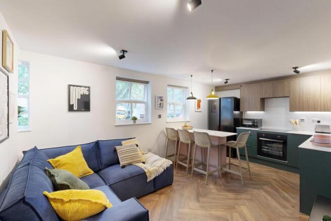 Bright, modern open-plan living area with a com...