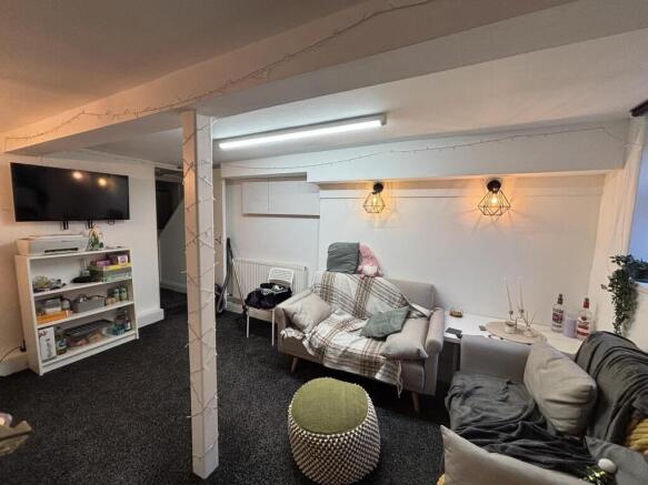 A cozy and well-maintained living room featurin...