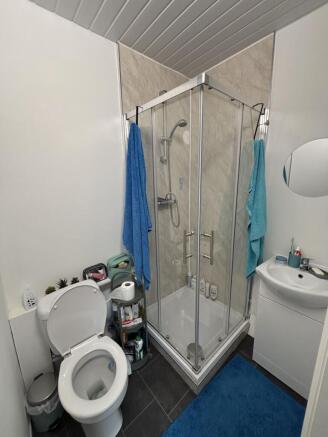 A clean and well-maintained bathroom with a sho...