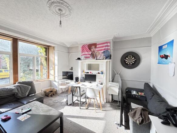 Bright and welcoming living room with large win...