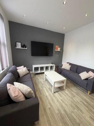 Bright, modern living room with two comfortable...