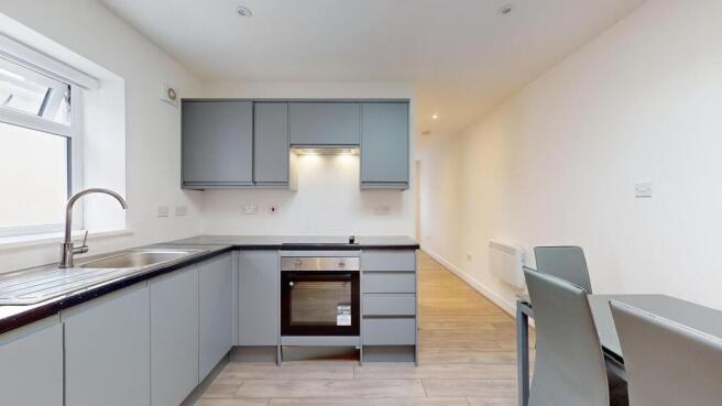 Bright modern kitchen with sleek grey cabinetry...