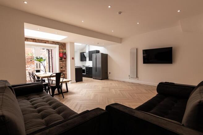 Bright, modern open-plan living area with a sty...