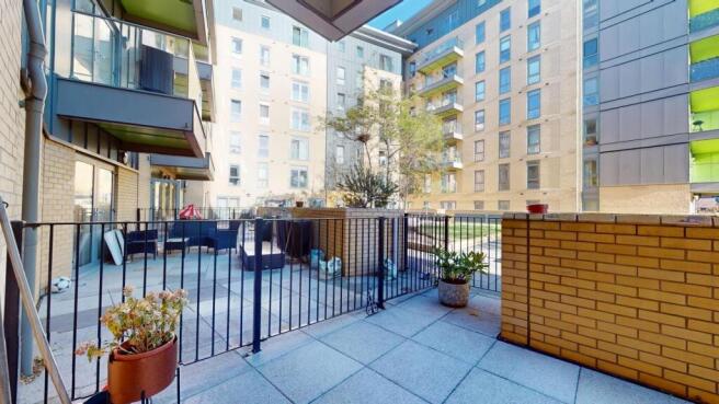 A view of the outdoor patio area with potted pl...