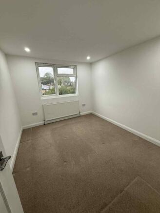 Bright and well-maintained master bedroom featu...