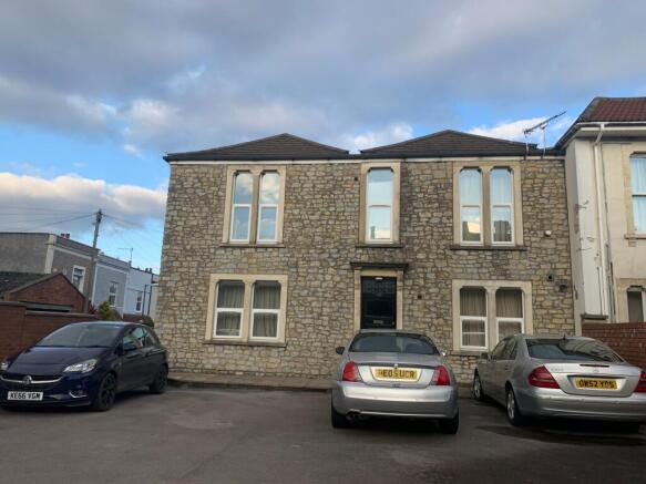 Stone-fronted terraced house with symmetrical w...