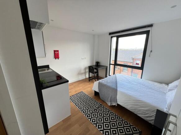 Bright, modern studio-style double bedroom with...