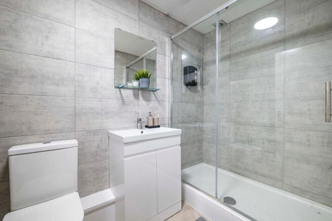 Contemporary tiled bathroom with a walk-in show...