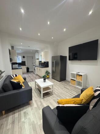 Bright, modern open-plan living area with match...