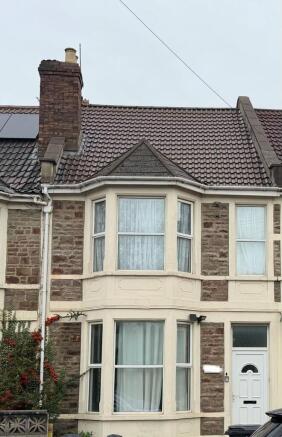 Classic terraced house with a bay window and de...