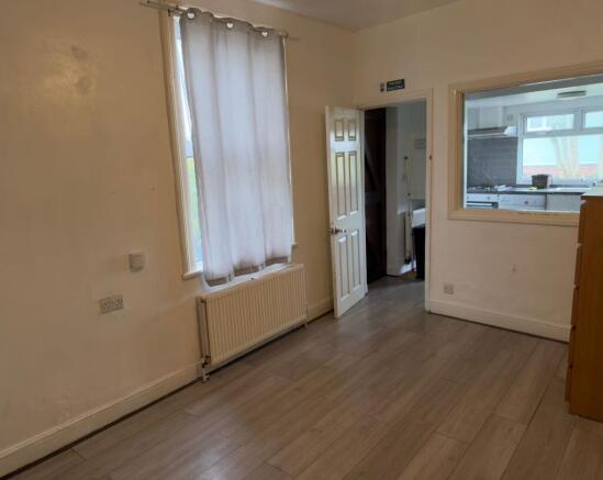 Bright ground-floor living area with wood-effec...