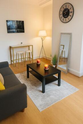 Modern and cozy living room featuring a sleek b...