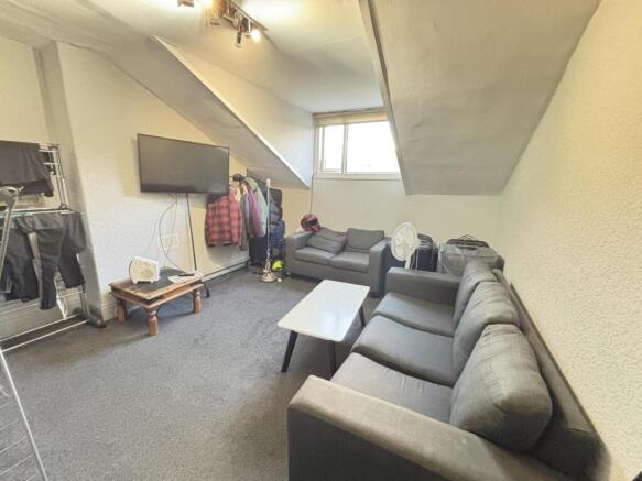 A spacious and well-maintained living room with...