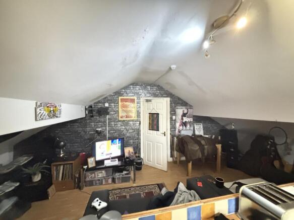 A spacious and well-lit contemporary living roo...